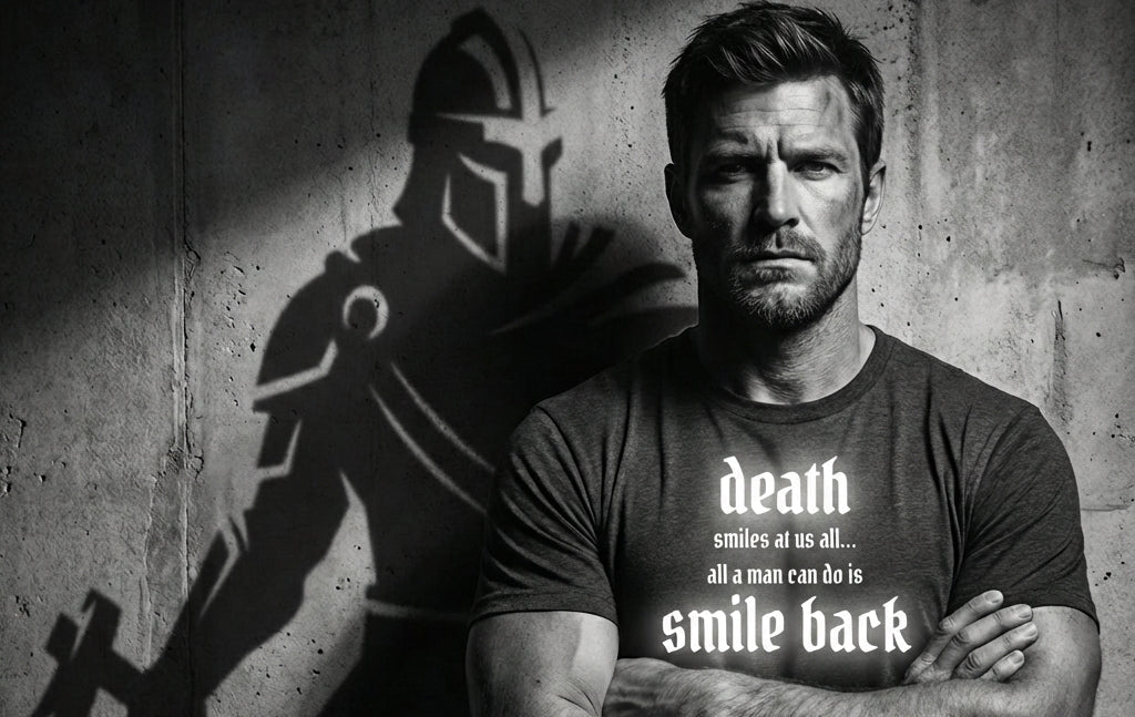 Man wearing a t-shirt with a motivational quote standing against a concrete wall with a warrior's shadow.